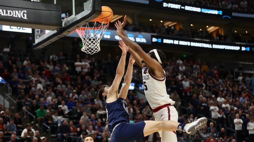 Dayton's DaRon Holmes II scores in the final minutes of the second half against Nevada in the first round of the NCAA tournament on Thursday, March 21, 2024, at the Delta Center in Salt Lake City, Utah. David Jablonski/Staff