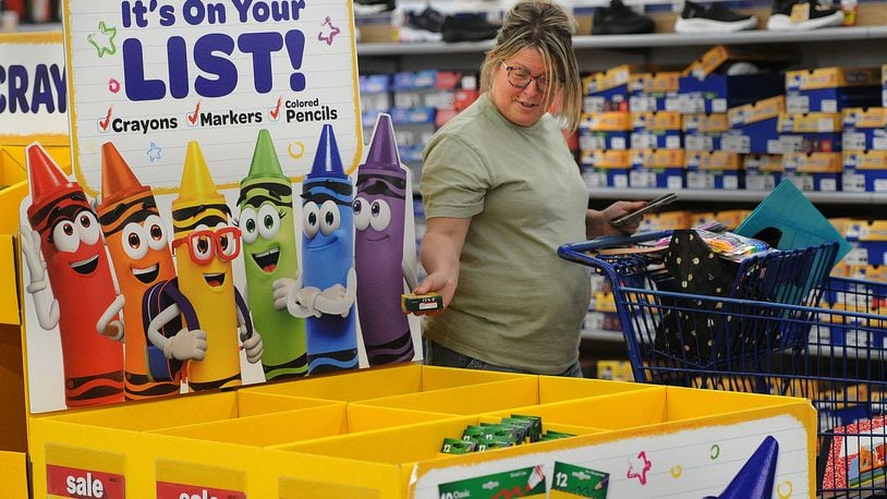 Crystal Houser, of Kettering, shops for school supplies for her two children at the Meijer store located at 4075 Wilmington Pike in Kettering Tuesday, July 25, 2023. Ohio’s Sales Tax Holiday runs from Aug. 4 through Aug. 6. Tax-free items include school supplies and books that cost $20 or less per item and clothing at $75 or less per item. MARSHALL GORBY/STAFF