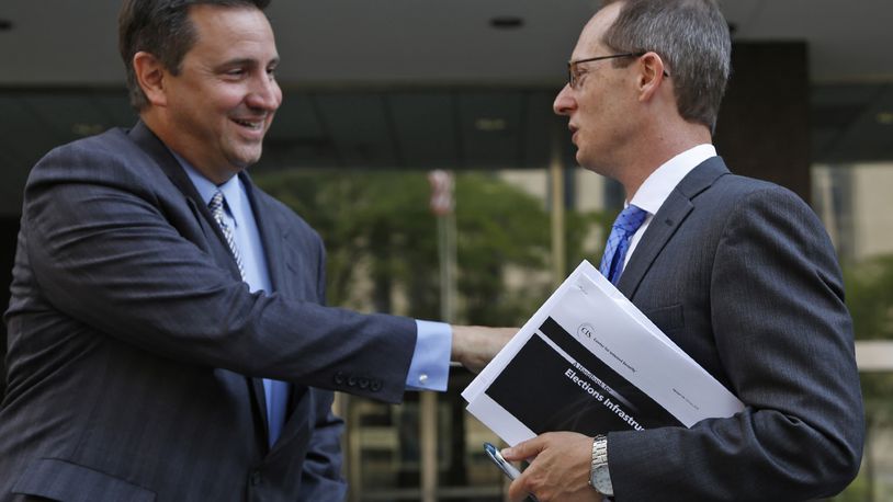 Attorney Nick Gounaris, left, talks with U.S. Attorney Benjamin Glassman after a hearing in Federal Court for Gounaris’s client Ethan Kollie who was charged with lying on a federal firearms form. The photo was taken in August. TY GREENLEES / STAFF