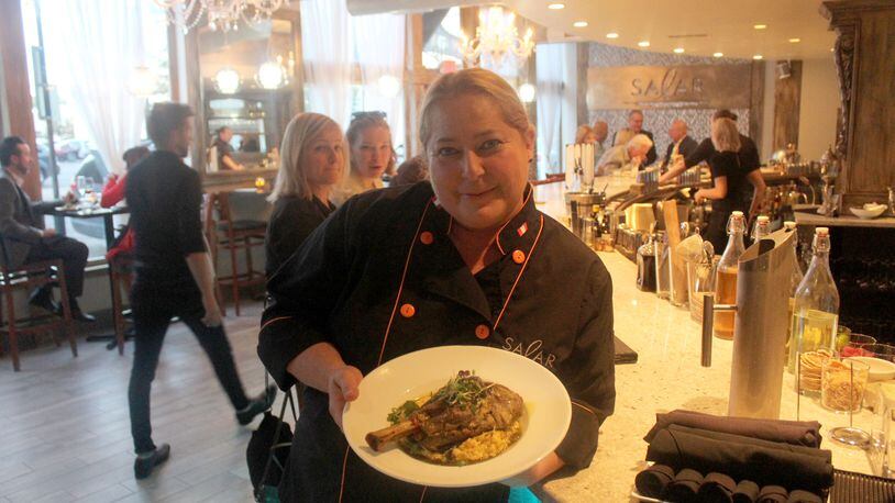 Salar Restaurant and Lounge  has been closed since a December fire. The restaurant in Dayton Oregon District is celebrating its reopening with event Sept 27 to 30, 2018. Chef/owner Margot Blondet holds a serving of Northern Peruvian style braised  lamb shank is pictured.