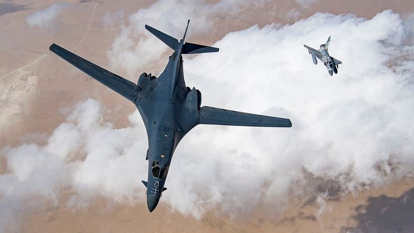 A U.S. Air Force B-1B Lancer bomber and a Qatari Mirage 2000 fly in formation during Joint Air Defense Exercise 19-01, Feb. 19, 2019. The aircraft participated with regional partners to test objective-based command and control actions during the exercise. U.S. AIR FORCE PHOTO/STAFF SGT. CLAYTON CUPIT