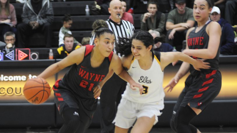 Wayne’s Destiny Bohanon (with ball) is guarded by Centerville’s Amy Velasco. Bohanon was first-team All-Ohio Division I and Velasco D-I special mention. MARC PENDLETON / STAFF