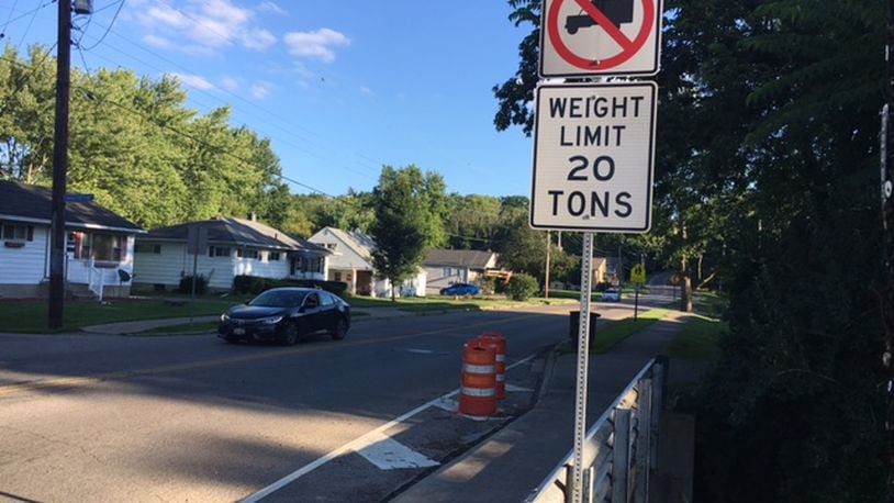 West Carrollton is planning to replace the Elm Street Bridge just south of the center of downtown. Southbound truck drivers are warned with the sign seen above. NICK BLIZZARD/STAFF