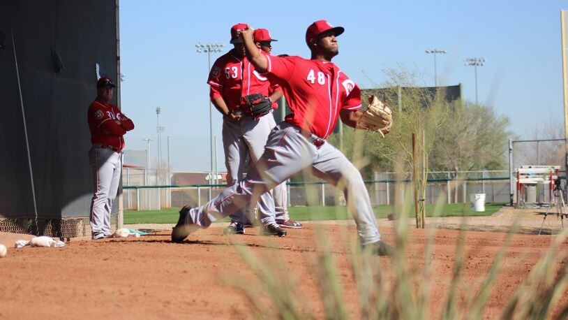 Reds manager watches some pitchers during a spring training workout on Monday, Feb. 23 in Goodyear, Ariz. Mike Hartsock/Staff