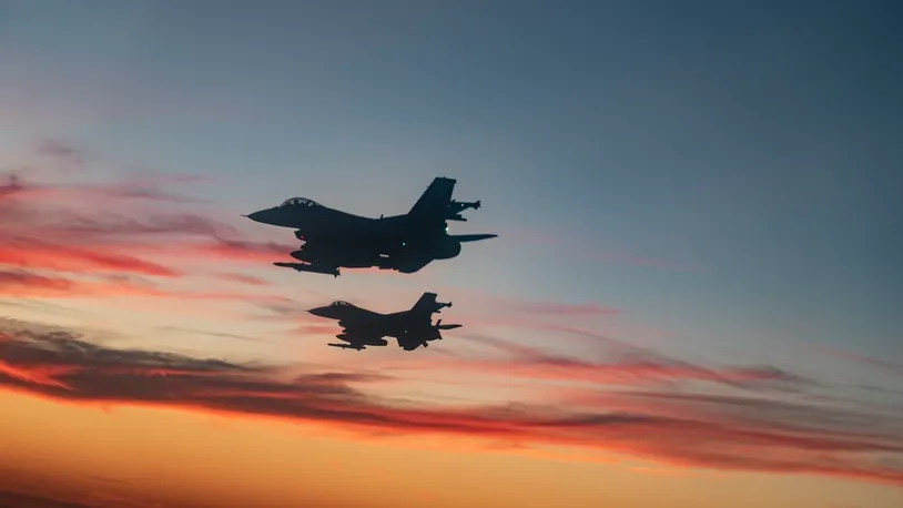 F-16 Fighting Falcons from Eglin Air Force Base fly over a high school football game in Niceville, Fla., Sept. 24, 2021.  (U.S. Air Force photo by Master Sgt. Tristan McIntire)