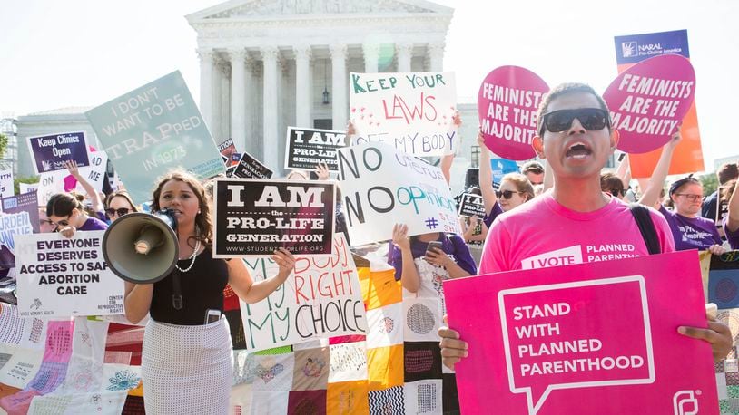 Pro-abortion rights and anti-abortion protesters rally in front of the U.S. Supreme Court in Washington, June 27, 2016. The court finished its term with a decision on abortion – a case deciding the constitutionality of two provisions of a Texas law regulating abortion could affect access to abortions for millions of women in several states.