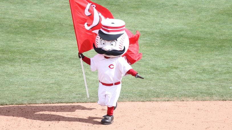 The Reds mascot, Mr. Redlegs, carries a flag after a victory against the Cardinals on Sunday, June 10, 2018, at Great American Ball Park in Cincinnati.
