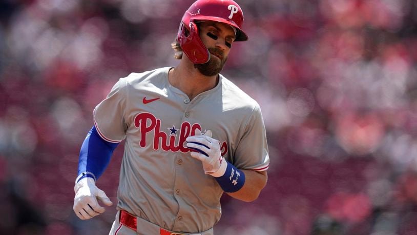 Philadelphia Phillies' Bryce Harper rounds the bases after hitting a two-run homer in the third inning of a baseball game against the Cincinnati Reds on Thursday, April 25, 2024, in Cincinnati. (AP Photo/Carolyn Kaster)
