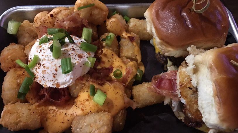 Loaded tots and sliders are some of the stars of the show at The Double 18 Lounge above Timothy's near the University of Dayton campus. ALEXIS LARSEN/CONTRIBUTED