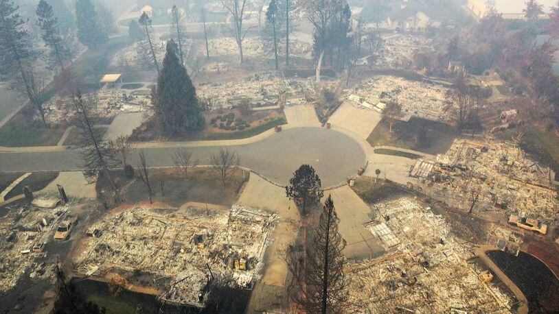 An aerial view of a neighborhood destroyed by the Camp Fire on November 15, 2018 in Paradise, California. A new report on climate change predicts rising temperatures will fuel more intense and numerous wildfires, not just in the West, but in the Southeast, too.