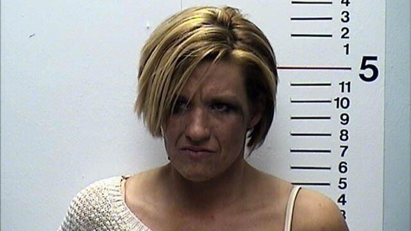 Carmen Statzer, 35, of Monroe, was charged with OVI and driving under suspension