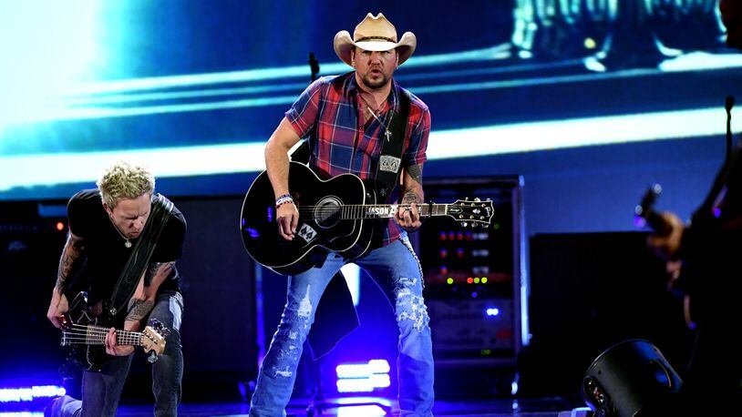 LAS VEGAS, NV - SEPTEMBER 21:  Tully Kennedy (L) and Jason Aldean perform onstage during the 2018 iHeartRadio Music Festival at T-Mobile Arena on September 21, 2018 in Las Vegas, Nevada.  (Photo by Kevin Winter/Getty Images for iHeartMedia)