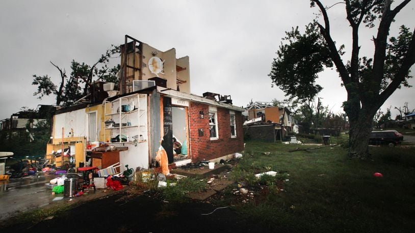 Three months after the Memorial Day tornadoes, little progress has been made on some houses like those in Trotwood on Greenbrook Drive seen Tuesday, Aug. 27, 2019. CHRIS STEWART / STAFF