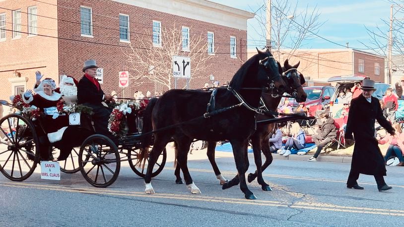 Tens of thousands of people watched the annual horse-drawn carriage parade and festival in downtown Lebanon, Ohio on Sat., Dec. 4, 2021. MANDY GAMBRELL/FILE PHOTO
