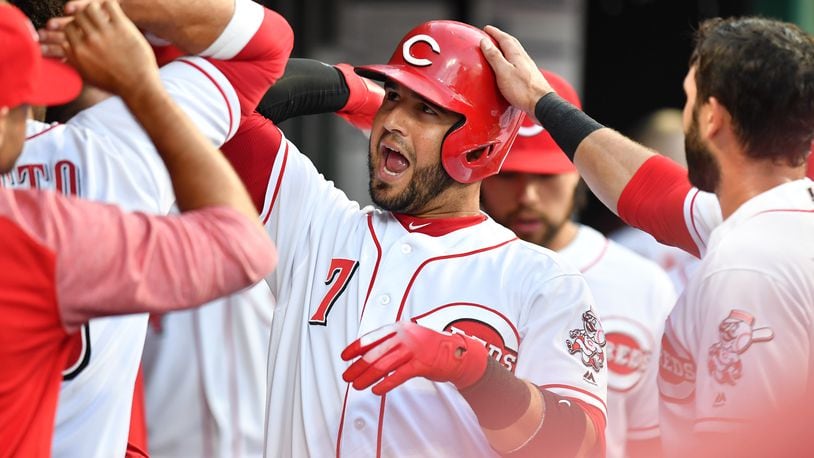 CINCINNATI, OH - JUNE 22: Eugenio Suarez #7 of the Cincinnati Reds celebrates in the dugout after hitting a two-run home run in the fifth inning against the Chicago Cubs at Great American Ball Park on June 22, 2018 in Cincinnati, Ohio. Cincinnati defeated Chicago 6-3. (Photo by Jamie Sabau/Getty Images)
