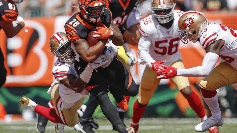 CINCINNATI, OH - SEPTEMBER 15: Joe Mixon #28 of the Cincinnati Bengals runs the ball as Dre Greenlaw #57 of the San Francisco 49ers makes the stop during the first half at Paul Brown Stadium on September 15, 2019 in Cincinnati, Ohio. (Photo by Michael Hickey/Getty Images) *** BESTPIX ***