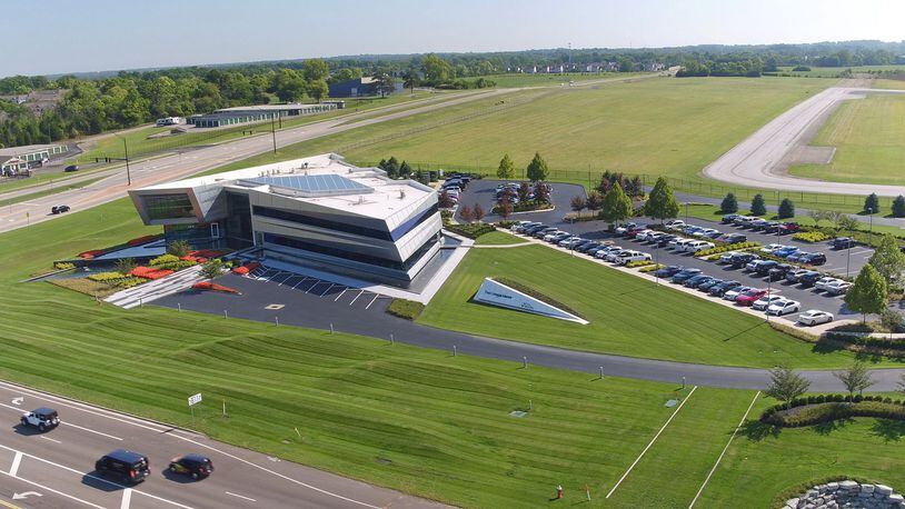 Zoning changes and FAA approvals have opened up City of Dayton land at the Dayton-Wright Brothers Airport for commercial and light industrial development. The open field past this corporate building owned by the Conner Group is one part of acreage approved for use. TY GREENLEES / STAFF