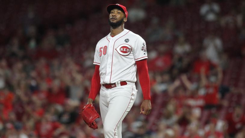 Reds reliever Amir Garrett reacts after striking out the side against the Brewers on Tuesday, July 2, 2019, at Great American Ball Park in Cincinnati.