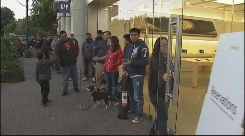 Consumers wait in Walnut Creek for the new iPhone