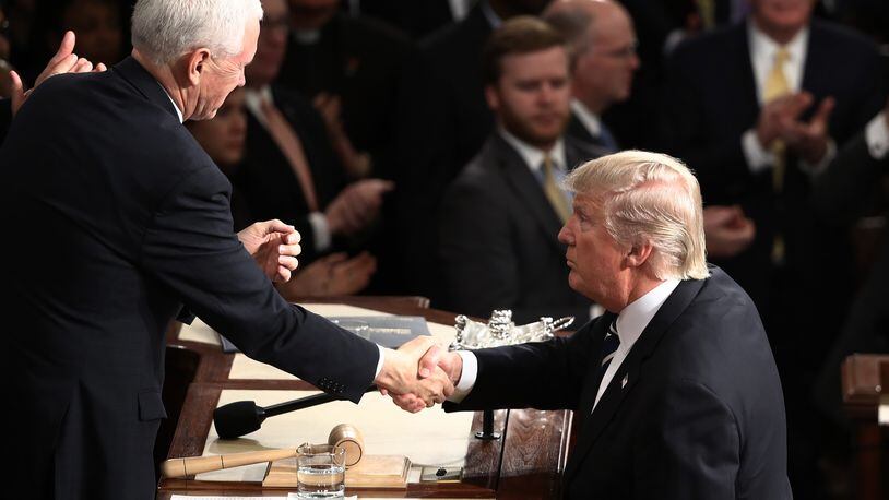 Vice President Mike Pence will visit Frame USA in Springdale Thursday. The event will be private. On Tuesday, President Donald Trump shook hands with Pence after Trump addressed a joint session of Congress. (Photo by Win McNamee/Getty Images)