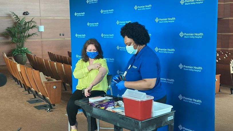 Claudia Cortez-Reinhardt receives her vaccine at the Kroc Center. KAITLIN SCHROEDER