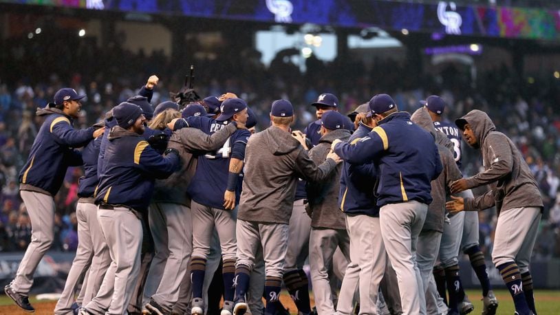 DENVER, CO - OCTOBER 07:  The Milwaukee Brewers  celebrate winning Game Three of the National League Division Series by defeating the Colorado Rockies at Coors Field on October 7, 2018 in Denver, Colorado. The Brewers won the game 6-0 and the series 3-0.  (Photo by Matthew Stockman/Getty Images)