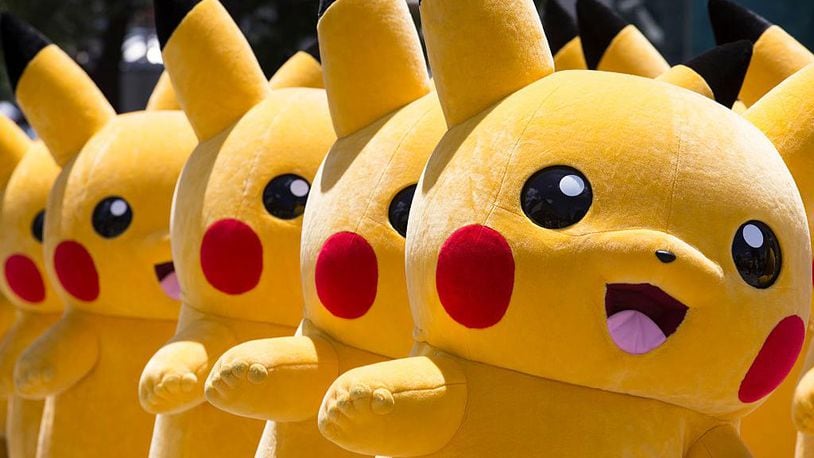 Performers dressed as Pikachu, a character from the Pokemon series game, march during the Pikachu Outbreak event hosted by The Pokemon Co. on August 7, 2016 in Yokohama, Japan. Universal Studios Orlando is planning to open a new Pokemon theme park in the next couple years, sources told WFTV.