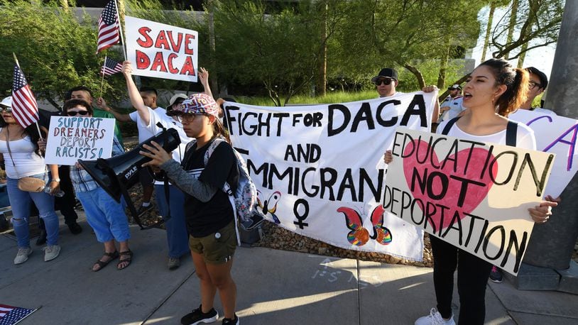 Demonstrators gather across the street from the Trump International Hotel & Tower Las Vegas for a “We Rise for the Dream” rally to oppose U.S. President Donald Trump’s order to end DACA on Sept. 10, in Las Vegas, Nevada.