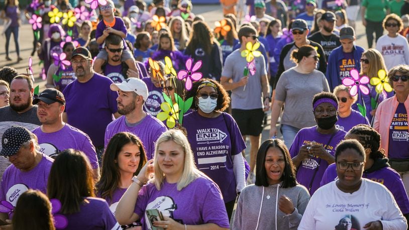 The Walk to End Alzheimer's in Dayton raises funds for the hotline, in home assessments, research, and more. Walkers in 2021 prepare for the annual walk held near downtown.