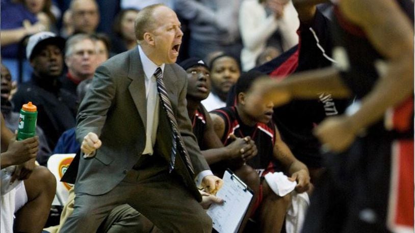 Cincinnati head coach Mick Cronin shouts instructions to his players during the overtime period of an NCAA basketball game against Georgetown, Saturday, Feb. 7, 2009, in Washington. The Bearcats won 64-62 in an overtime.