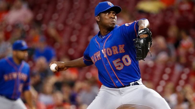 New York Mets starting pitcher Rafael Montero throws in the ninth inning of the team’s baseball game against the Cincinnati Reds, Wednesday, Aug. 30, 2017, in Cincinnati. The Mets won 2-0. (AP Photo/John Minchillo)