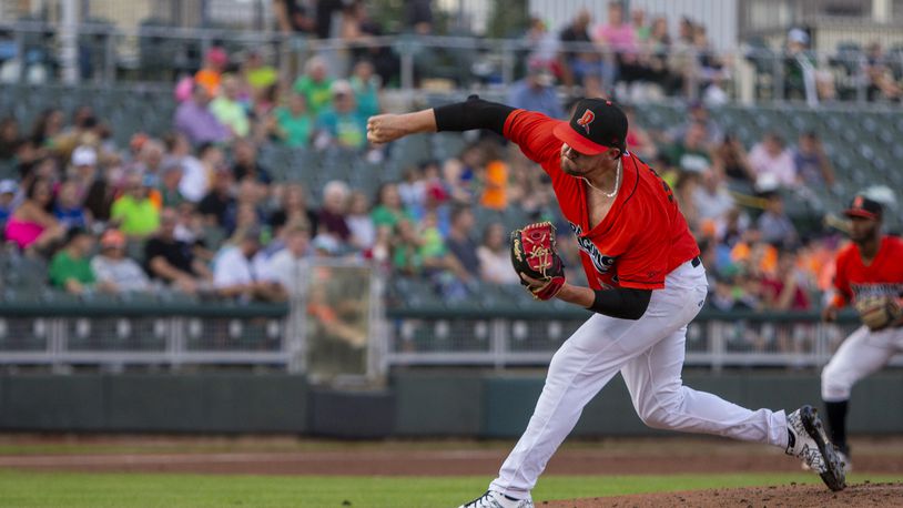 Dragons starter Graham Ashcraft fires a second-inning pitch during Friday night's game against Great Lakes at Day Air Ballpark. He pitched six scoreless innings, allowed two hits, walked two and struck out 10. Jeff Gilbert/CONTRIBUTED