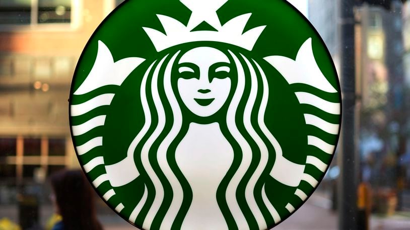 FILE - The Starbucks logo is displayed in the window of a downtown Pittsburgh Starbucks on Monday, Nov. 7, 2022. (AP Photo/Gene J. Puskar, File)