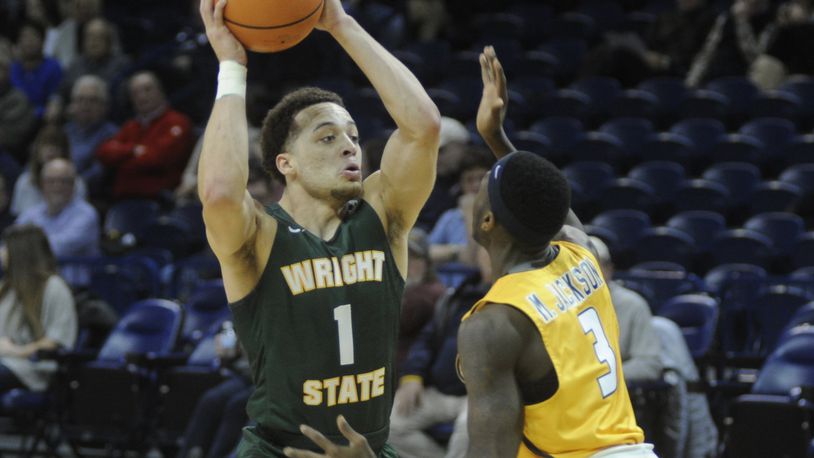 WSU’s Justin Mitchell (with ball) scored 18 points. Wright State defeated host Toledo 77-69 in a men’s college basketball game on Sat., Dec. 16, 2017. MARC PENDLETON / STAFF