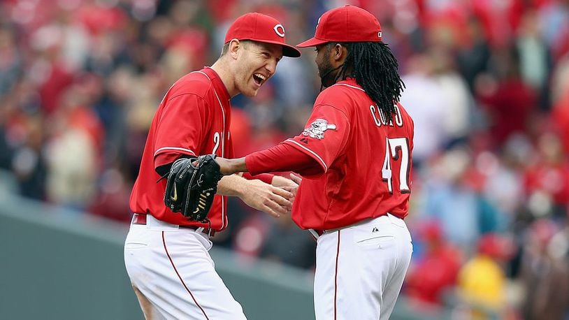 CINCINNATI, OH - MAY 15: Todd Frazier #21 and Johnny Cueto #47 of the Cincinnati Reds celebrate after the Reds 5-0 win in the first game of a doubleheader against the San Diego Padres at Great American Ball Park on May 15, 2014 in Cincinnati, Ohio. Cueto pitched a complete game shutout. (Photo by Andy Lyons/Getty Images)