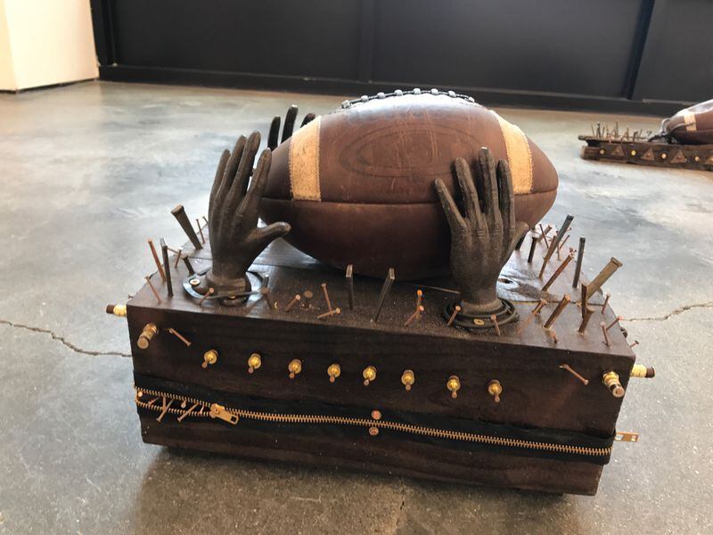 One of the kneelers on display by Bing Davis "Kneeling." 25W in downtown Dayton. It is on display until Sunday at the Contemporary Dayton Gallery on Force Street.Tom Archedicon / Staff