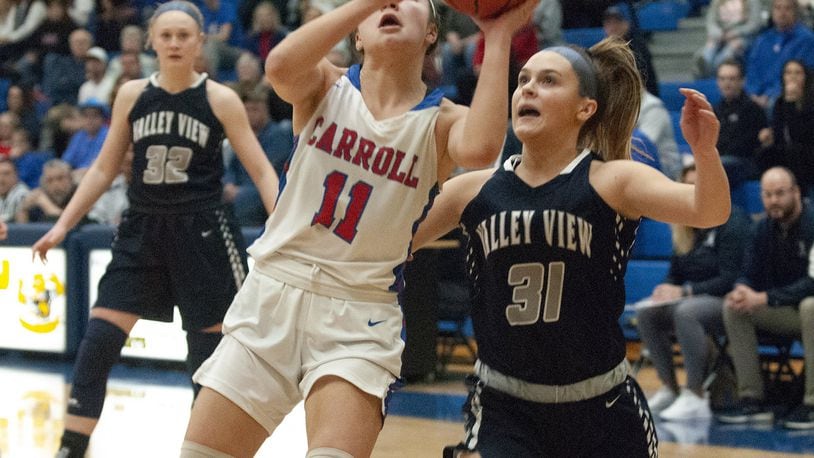 Carroll’s Ava Lickliter drives against Valley View’s Kailee Ramps during the first half of Tuesday night’s Division II regional semifinal at Springfield High School. Jeff Gilbert/CONTRIBUTED
