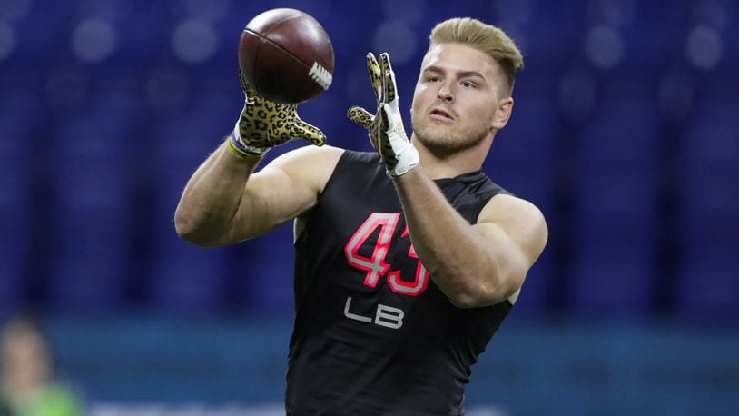 FILE - In this Feb. 29, 2020, file photo, Wyoming linebacker Logan Wilson runs a drill at the NFL football scouting combine in Indianapolis. Wilson was selected by the Cincinnati Bengals in the third round of the NFL football draft Friday, April 24, 2020. (AP Photo/Michael Conroy, File)