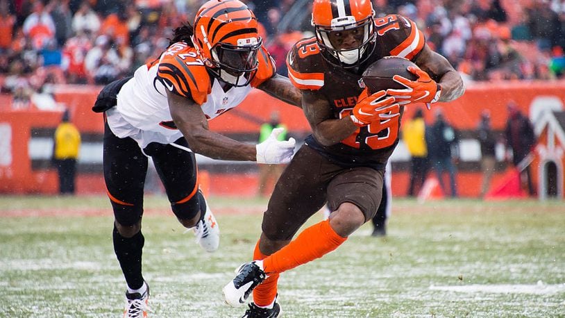 CLEVELAND, OH - DECEMBER 11: Cornerback Dre Kirkpatrick #27 of the Cincinnati Bengals tackles wide receiver Corey Coleman #19 of the Cleveland Browns during the second half at FirstEnergy Stadium on December 11, 2016 in Cleveland, Ohio. The Bengals defeated the Browns 23-10. (Photo by Jason Miller/Getty Images)