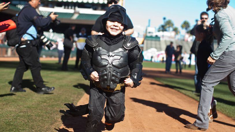 eukemia survivor Miles, 5, dressed as BatKid, runs the bases as part of a Make-A-Wish foundation fulfillment at AT&T Park November 15, 2013 in San Francisco. The Make-A-Wish Greater Bay Area foundation turned the city into Gotham City for Miles by creating a day-long event bringing his wish to be BatKid to life.