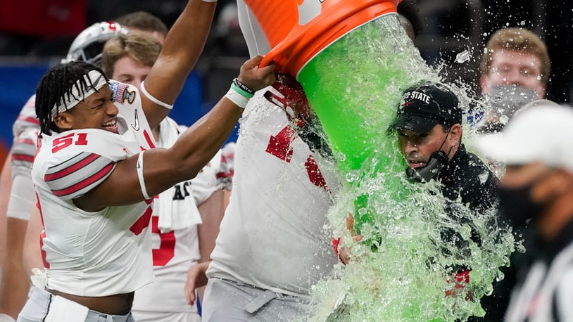 Ohio State head coach Ryan Day get soaked with a sports drink after their win against Clemson during the second half of the Sugar Bowl NCAA college football game Saturday, Jan. 2, 2021, in New Orleans. (AP Photo/John Bazemore)