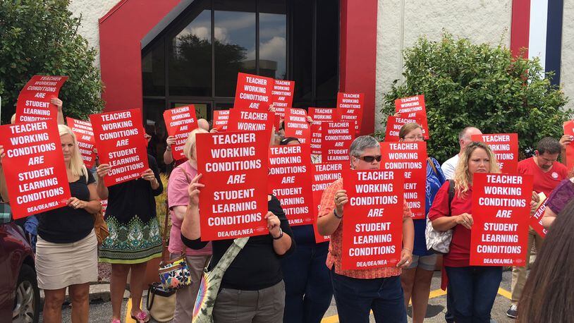 Dayton Education Association members last week protested the lack of a new contract with Dayton Public Schools. Teachers have authorized a strike if a deal is not reached by Aug. 11. STAFF
