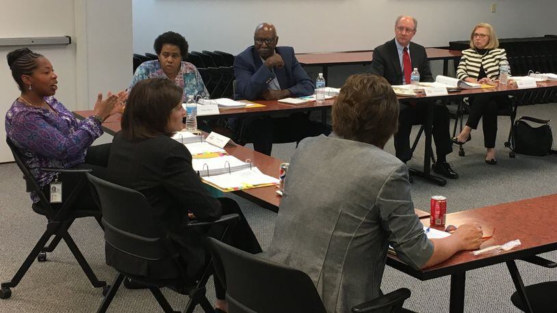 Preschool Promise Board member Anissa Lumpkin (left) addresses the rest of the board during the Wednesday, May 17, 2017 meeting. Around the table, from top right, are, Jane McGee Rafal, board attorney Chas Kidwell, Clay Dixon, Tasha Maye, Lumpkin, Debbie Feldman and Michelle Riley. JEREMY P. KELLEY / STAFF