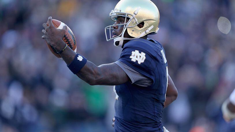 NASHVILLE, TN - DECEMBER 30: Malik Zaire #8 of the Notre Dame Fighting Irish runs for a touchdown against the LSU Tigers during the Franklin American Mortgage Music City Bowl at LP Field on December 30, 2014 in Nashville, Tennessee. (Photo by Andy Lyons/Getty Images)
