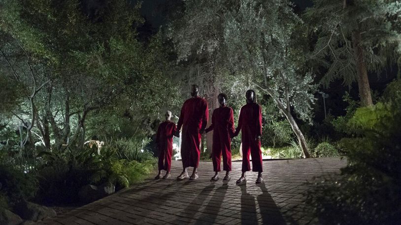 This image released by Universal Pictures shows Evan Alex, from left, Winston Duke, Shahadi Wright Joseph and Lupita Nyong'o in a scene from "Us," written, produced and directed by Jordan Peele. (Claudette Barius/Universal Pictures via AP)