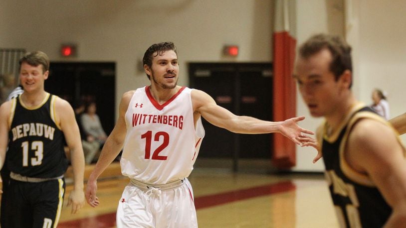 Wittenberg’s Mitch Balser celebrates after a 3-pointer at the end of the first half against DePauw on Wednesday, Jan. 24, 2018, at Pam Evans Smith Arena in Springfield. David Jablonski/Staff