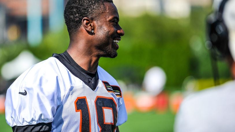 Wide receiver A.J. Green smiles as he is interviewed after the first day of Cincinnati Bengals Training Camp Friday, July 28 at the practice fields beside Paul Brown Stadium in Cincinnati. NICK GRAHAM/STAFF