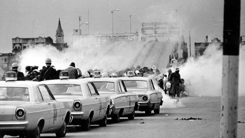 March 7, 1965: clouds of tear gas fill the air as state troopers, ordered by Gov. George Wallace, break up a demonstration march in Selma, Ala., on what became known as "Bloody Sunday." The Journal and Constitution chose not to send staff reporters to cover some of the biggest moments of the civil rights movement.  (AP Photo/File)