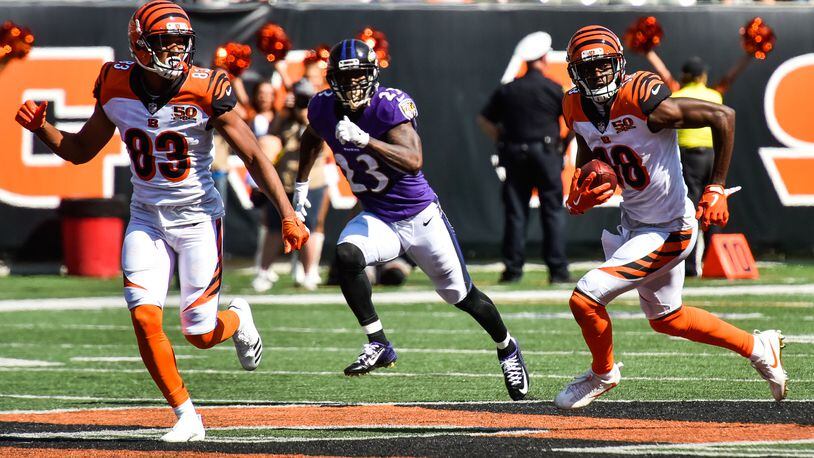 The Cincinnati Bengals wide receiver Tyler Boyd (83) looks to block for wide receiver A.J. Green as he carries the ball during their 20-0 loss to the Baltimore Ravens Sunday, Sept. 10 at Paul Brown Stadium in Cincinnati. NICK GRAHAM/STAFF