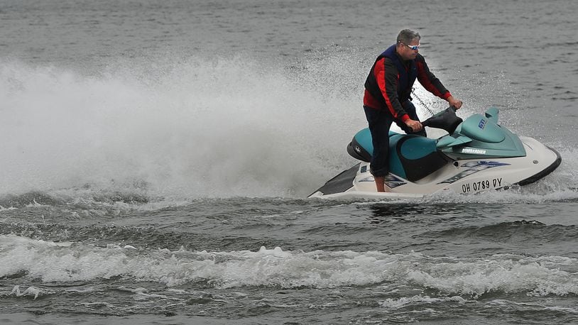 Joe Sheen takes advantage of the 60 degree weather on Monday, Dec. 27, 2021, to test ride a JetSki at Eastwood Lake that he repaired. MARSHALL GORBY\STAFF